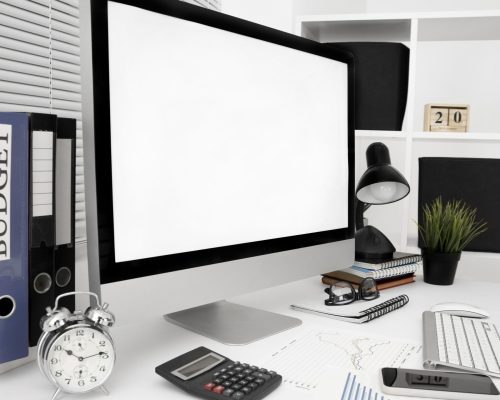 office-workspace-with-computer-screen-lamp